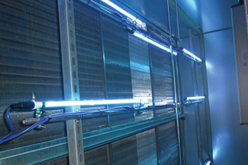A close-up of a stainless steel UV light system in a home.